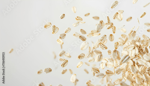 Flying raw oatmeal on white background photo