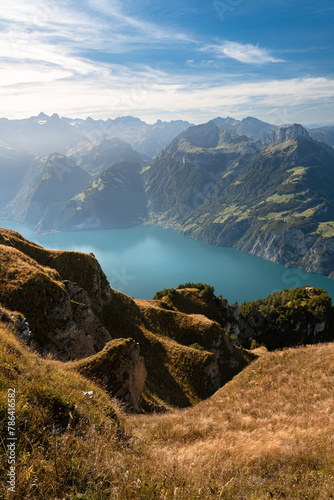 Lake in a valley seen from Fronalpstock summit in Switzerland. Swiss Alps iconic view