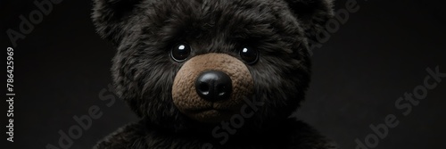 cute black teddy bear stuff toy on plain black background from Generative AI
