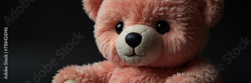 cute pink teddy bear stuff toy on plain black background from Generative AI