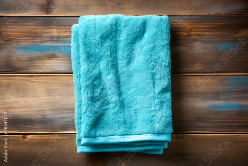 Crisp Turquoise Towel on Wooden Background Texture