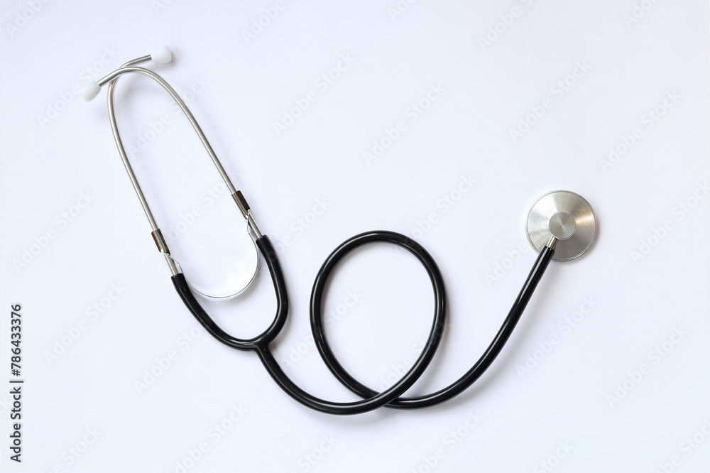 Stethoscope on a white background, top view. Medical instrument. Cardiology and medicine concept, healthcare. Auscultation device Stethoscope on a white background, top view. Medical instrument. Cardiology and medicine concept, healthcare. Auscultation device
