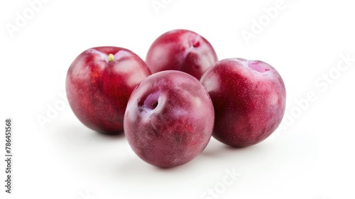 Plum colored plums set apart against a white background © 2rogan