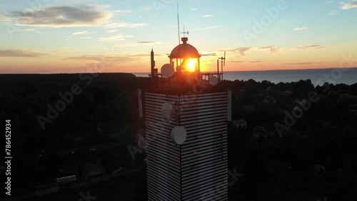 Red Hill Lighthouse, Russia. Calm and magical sunset at the picturesque cape. photo