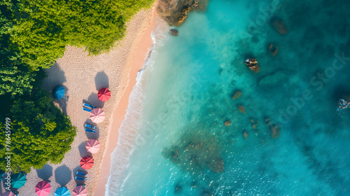 Aerial View of a Pristine Tropical Beach with Sunshades and Turquoise Sea