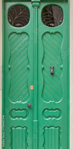 Spain. green wooden double door to private residents