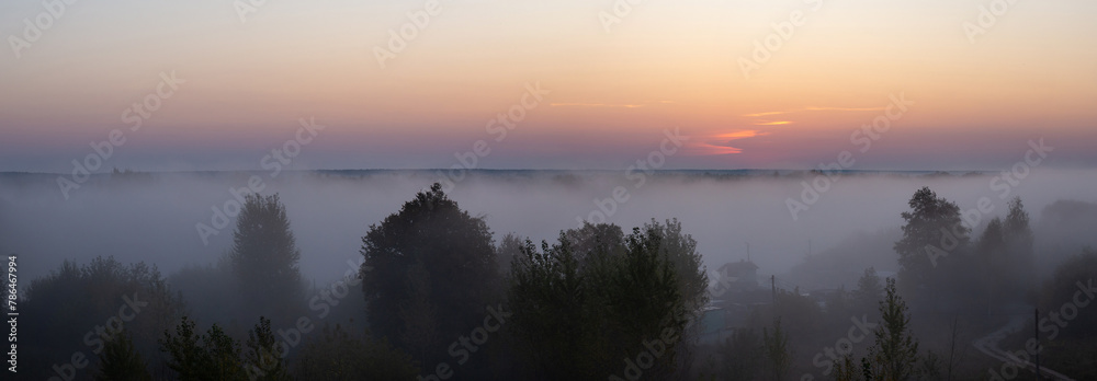 Fototapeta premium Beautiful foggy morning, mystical and mesmerizing landscape