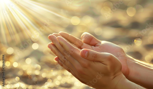 Hands  pray and person with spiritual  flare and faith for grace  light and forgiveness with sunshine. Praise  Christian and outdoor with nature and believe with worship and compassion with gratitude