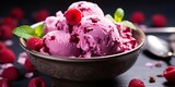 Raspberry ice cream with fresh raspberries and mint leaves