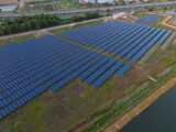 Solar cells farming beside with rivers and factories in industrial area. Green World concept with the ecosystem with technology recycling.