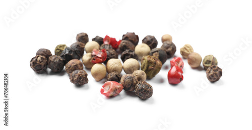 Aromatic spices. Pile of different peppers isolated on white