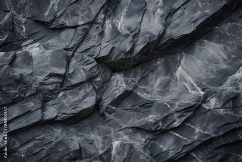 Black white rock texture. Dark gray stone granite background for design. Rough cracked mountain surface. Cracked layered mountain surface. © Acconite