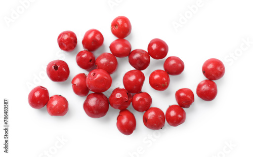 Aromatic spice. Many red peppercorns isolated on white, top view