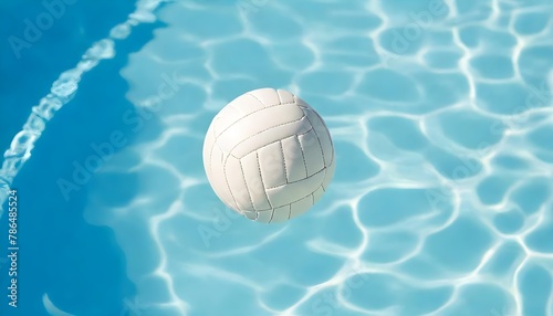 White volleyball floating in a pool with clear blue water