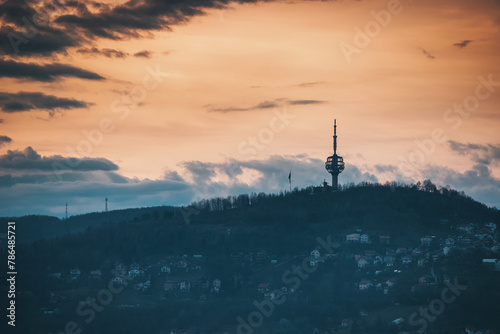 Sarajevo's captivating cityscape from above and the iconic TV tower rising tall against the sunset skyline.