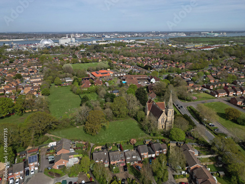 Marchwood village with church and recreational grounds. Aerial towards Power Station and Southampton.