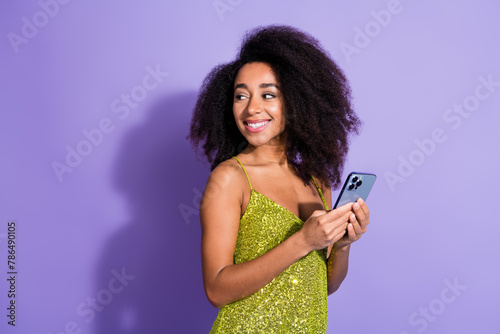 Photo of nice lovely shiny woman blogger wear stylish clothes look empty space isolated on purple color background