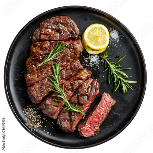 Obraz na płótnie Beef steaks with rosemary and meat juice on black plate w salonie
