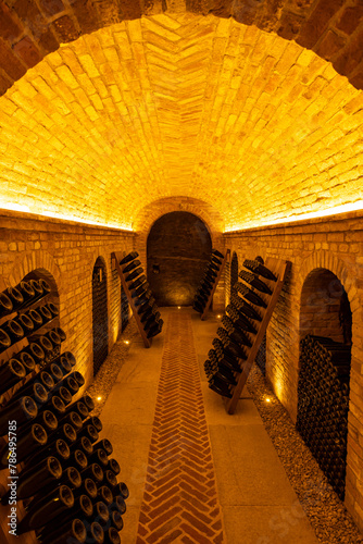 Stored wine bottles, wine cella, Canale, Piedmont, Italy photo
