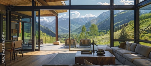 Expansive windows capture breathtaking mountain vistas, blurring indoor-outdoor boundaries. 