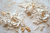 white and gold floral relief design on textured background