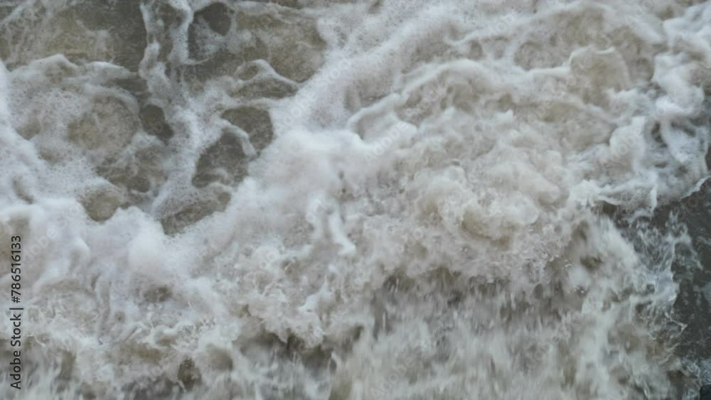 Erupted flood in the wild. Power of water in the spring. dam break, natural disaster on the river Erupted flood in the wild. Power of water in the spring. dam break, natural disaster on the river