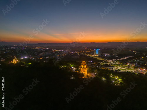 Aerial view of Nhan temple, tower is an artistic architectural work of Champa people in Tuy Hoa city, Phu Yen province, Vietnam. Sunset view. © CravenA