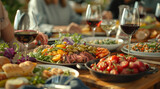 A table full of food and wine with a group of people gathered around it. Scene is festive and social, as the people are enjoying a meal together
