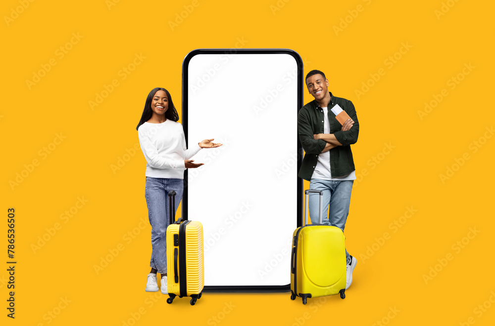 Traveling couple showing phone with blank screen Traveling couple showing phone with blank screen