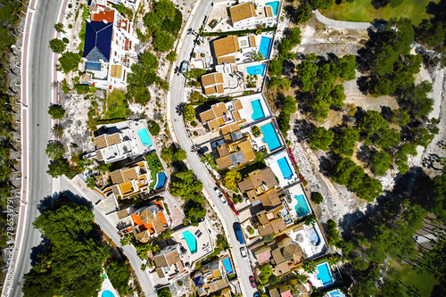 Drone point of view of luxury villas with swimming pools. Spain