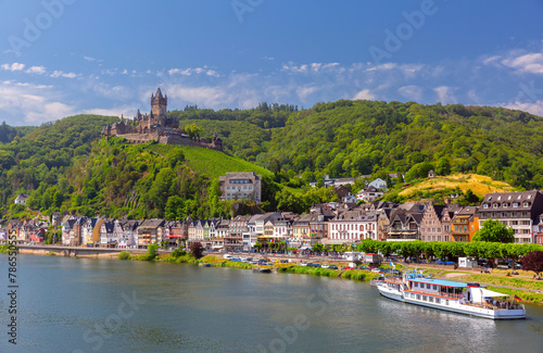 View of sunny Cochem with Reichsburg castle, beautiful town on romantic Moselle river, Germany