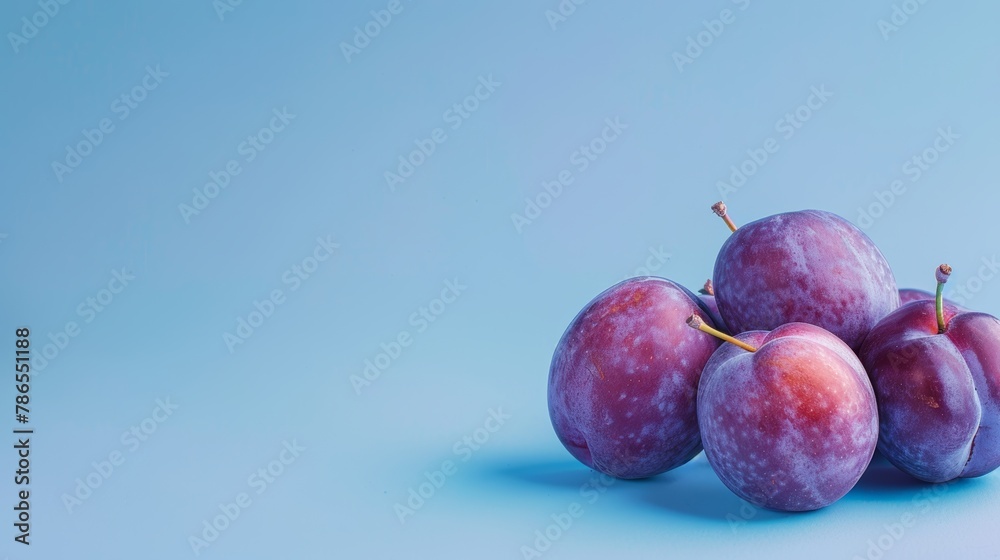 Plums A photorealistic illustration against pastel blue background with copy space for text or logo, beautifully illuminated by studio lighting