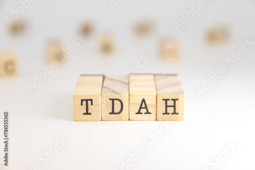 abbreviation for attention deficit hyperactivity disorder in Spanish TDAH letters isolated on white background. photo