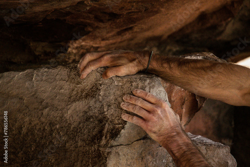 Hands of a bouldering climber photo