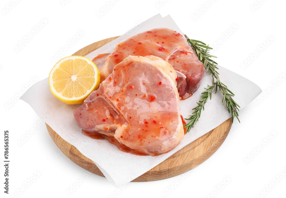 Board with raw marinated meat, lemon and rosemary isolated on white