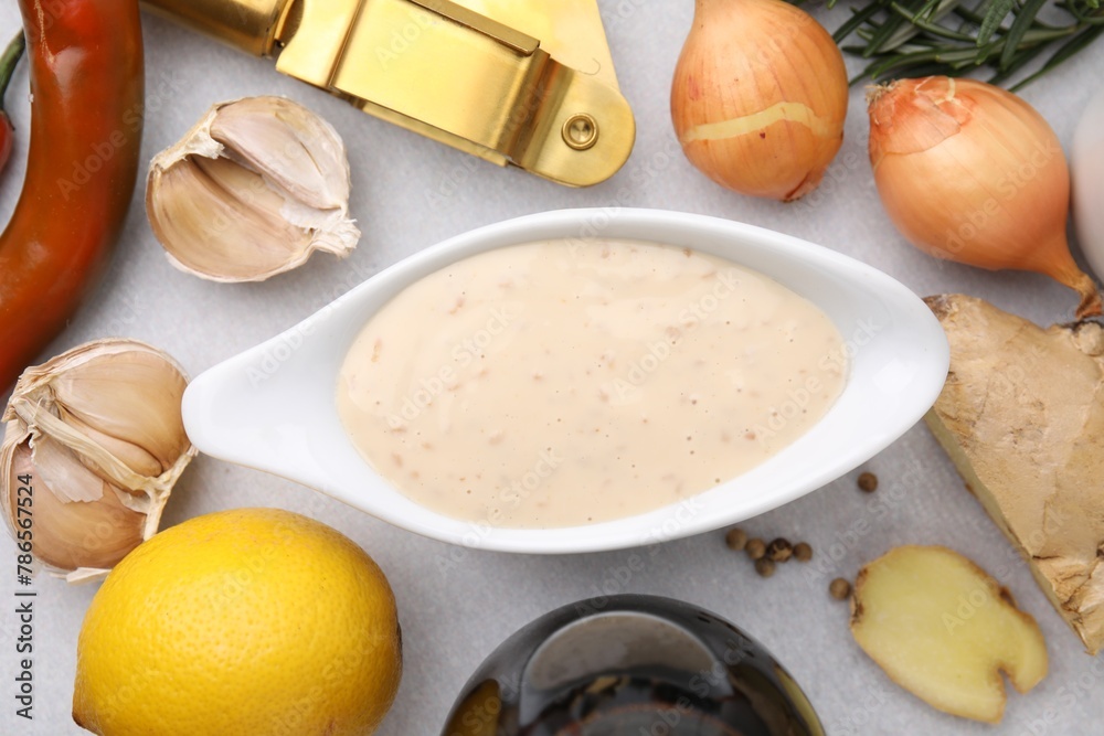 Fresh marinade and different ingredients on light grey table, flat lay Fresh marinade and different ingredients on light grey table, flat lay