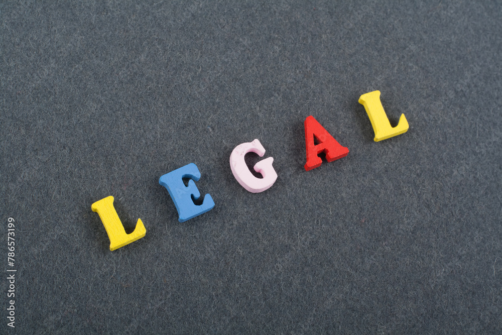 LEGAL word on black board background composed from colorful abc alphabet block wooden letters, copy space for ad text. Learning english concept. LEGAL word on black board background composed from colorful abc alphabet block wooden letters, copy space for ad text. Learning english concept.