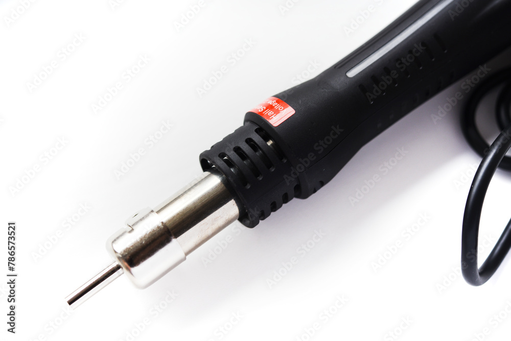 The heat gun of the soldering station. Soldering iron for electronic circuit boards on a white background. The heat gun of the soldering station. Soldering iron for electronic circuit boards on a white background.