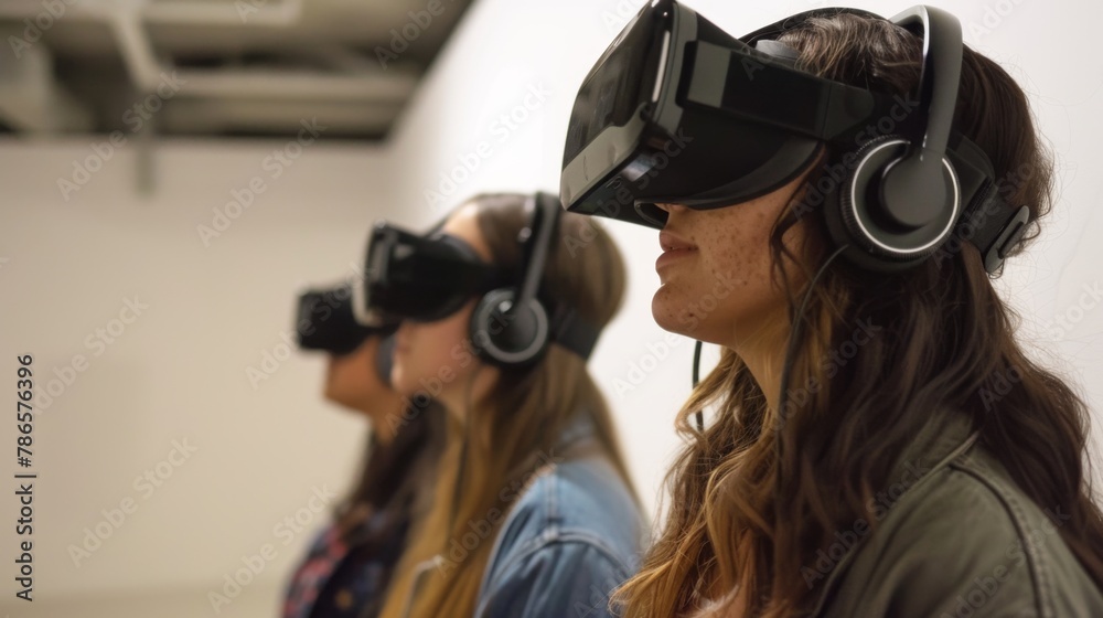Three Women Wearing Virtual Headsets in a Room Three Women Wearing Virtual Headsets in a Room