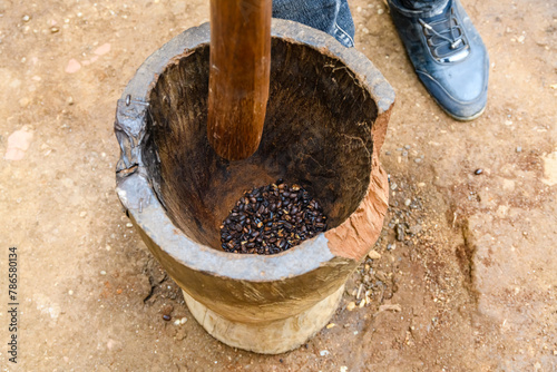 Grinding coffee in a mortar in Chagga tribe