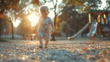 A peaceful image of a toddler enjoying a walk in the park at sunset. Suitable for family and lifestyle concepts