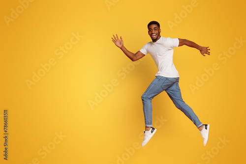 Funny young black man walking on air