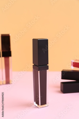 Many different lip glosses on color background © New Africa