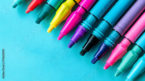 A set of multi-colored felt-tip pens on a white background. Drawing markers pencils rainbow ink artist tools creative pursuit leisure hobby. Colorful school supplies close up. Right.