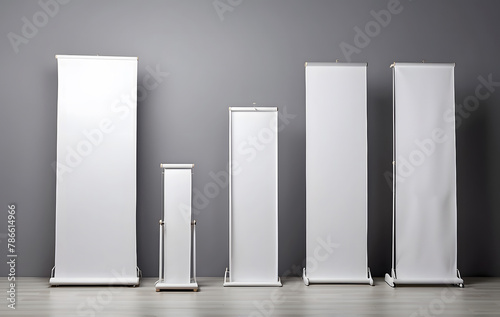 A collection of blank roll-up, pop-up, or pull-up banner stands, perfect for advertising, marketing, or promotional purposes, presented as mock-ups
