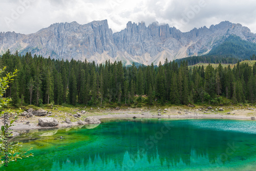 Blue lake in Dolomite Moutains, Italy, Carezza lake Lago di Carezza, Karersee with Mount Latemar, Bolzano South Tyrol, Italy.