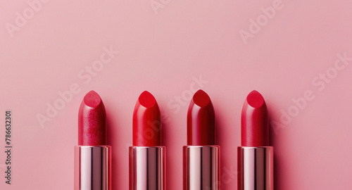 Various shades of red lipstick on pink background, spring and summer makeup trends, cosmetic beauty and personal care © Anzhela