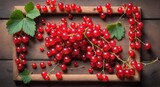Fresh red currant on wooden table background. Top view