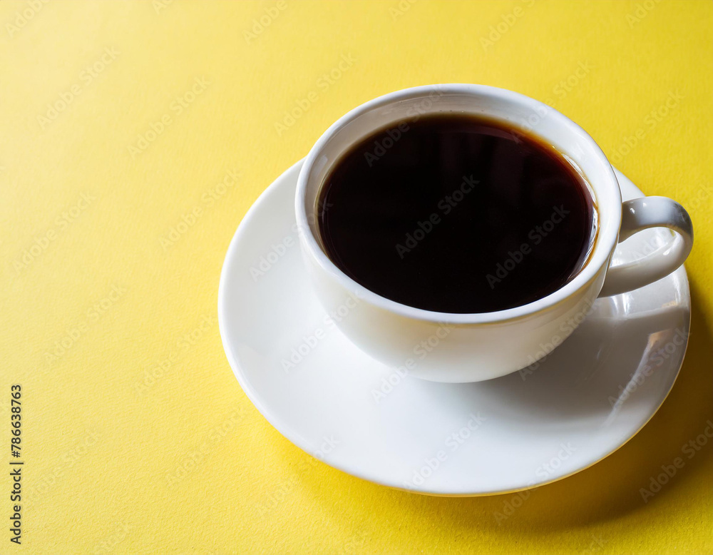 A cup of black coffee on a yellow background. A cup of black coffee on a yellow background.