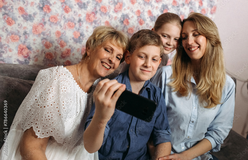 Happy Family on Couch Taking Selfie Happy Family on Couch Taking Selfie